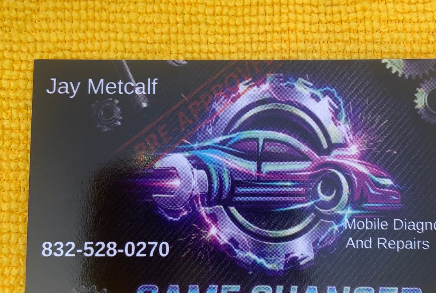 Jay Metcalf's business card resting on a shop towel
