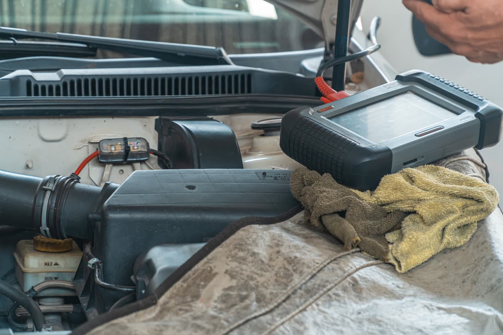 Diagnostic equipment set up on an engine bay during service